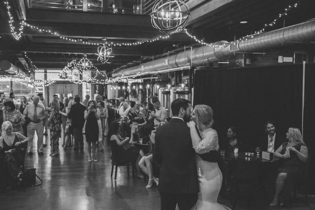 Bride and Groom sharing their first dance at the Ironclad Brewery