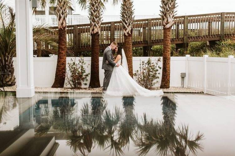 Bride and Groom at the pool at Luxury Lodging by Laura